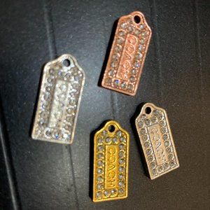 4 small metal and rhinestone Coach Charms